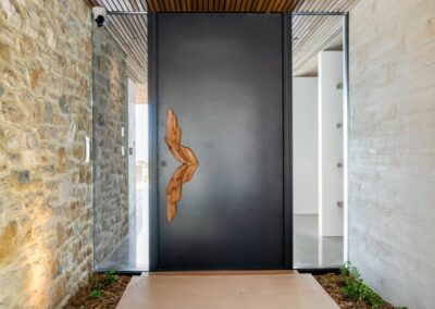 feature front door, beach house. cedar, feature paving, large paving tiles, feature stone wall