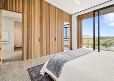 master bedroom, cedar paneling, ensuite, ocean view, high end beach house, polished concrete