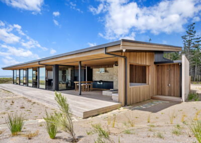 outdoor shower, beach house, cedar cladding, large joinery, black joinery, northland beach house